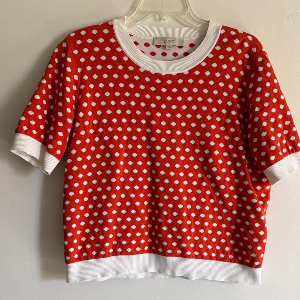 Loft brand short sleeve sweater in orange and white polka dots.